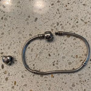 Pandora silver charm bracelet. Comes with a heart charm! 18 cm in length